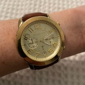 Gold Michael Kors watch with brown leather band